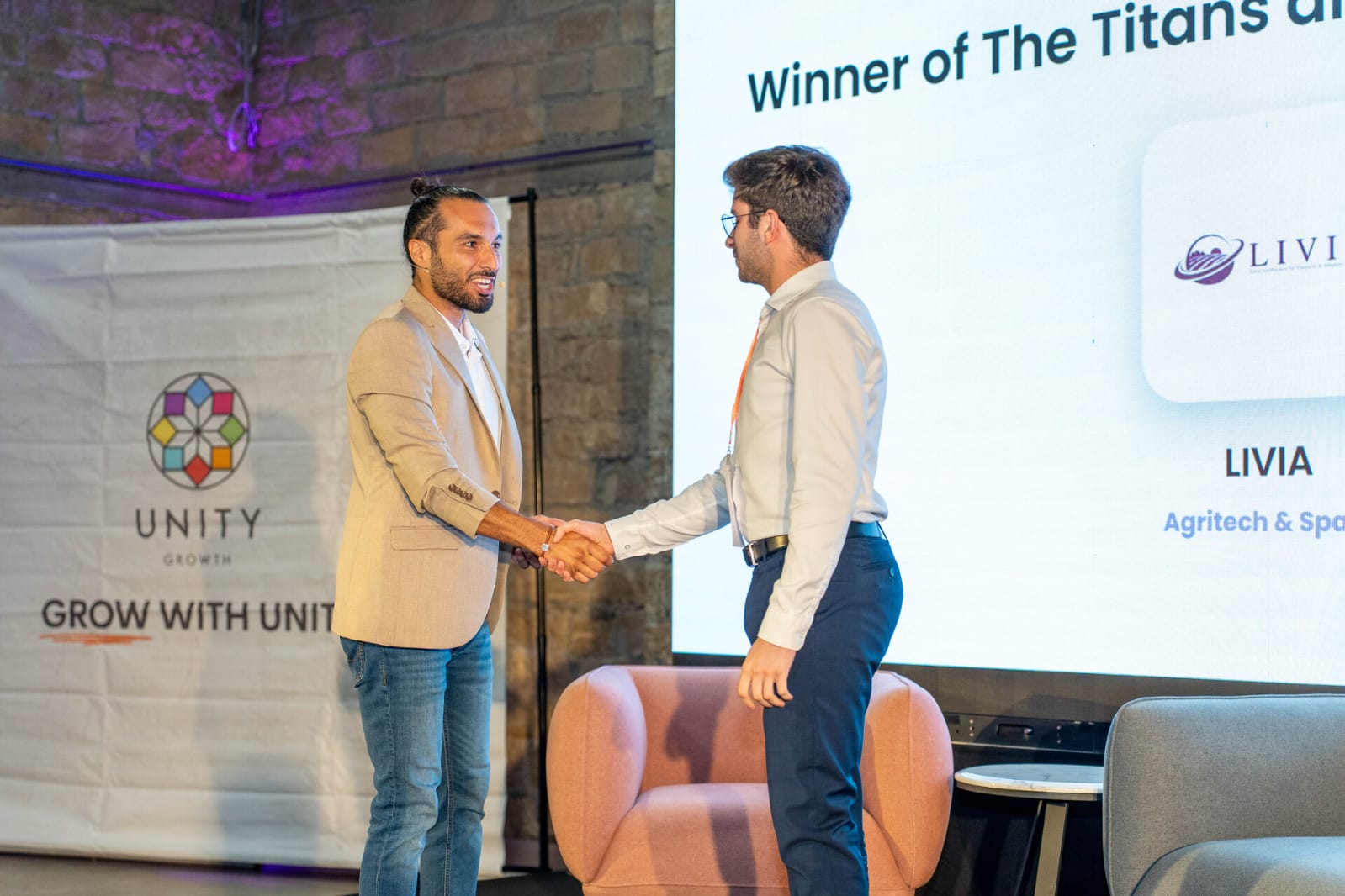 Christos receiving an award for LIVIA